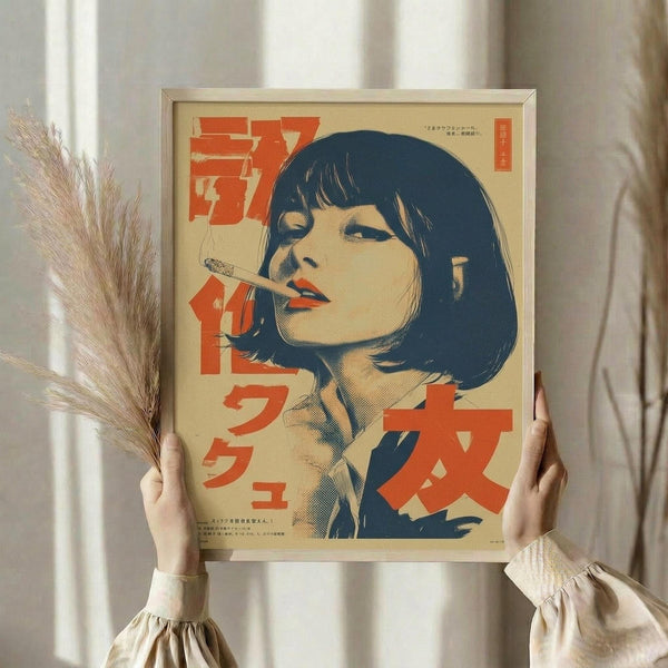 May include: Hands holding framed vintage Japanese poster featuring woman with black bob haircut smoking cigarette, rendered in retro illustration style with cream background and bold red text characters. Person wears beige ruffled sleeves, dried wheat stems visible on left side against soft neutral wall with natural window lighting.