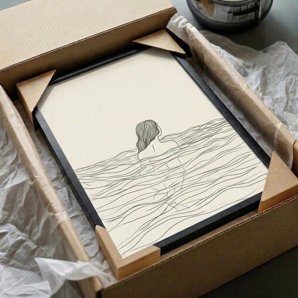 May include: Minimalist line drawing of a woman with flowing hair submerged in wavy water, rendered in black ink on cream-colored paper. The artwork is displayed in a thin black frame, carefully packaged in brown cardboard shipping materials with protective tissue paper wrapping.