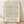 May include: Framed poster with William Morris floral pattern in peach and blue tones, featuring intricate botanical design with curving vines and blooms. Exhibition details for Cotton Prints show in South Kensington displayed below artwork. Light wood frame sits on wooden floor against white textured wall with soft natural lighting casting diagonal shadows.