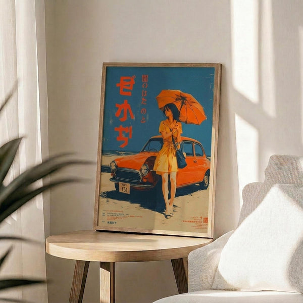 May include: Framed vintage-style Japanese poster featuring woman in orange dress holding orange umbrella beside orange classic car on beach, with blue sky background and red Japanese text. Poster displayed on round wooden side table next to beige upholstered chair with throw pillow, plant leaves visible in corner, natural sunlight streaming across white walls.