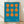 May include: Framed geometric art print with turquoise blue background and orange circular shapes arranged in a 3x3 grid pattern. Two circles on left and right sides connect to form hourglass or figure-8 shapes, while center column shows three separate circles. White text at bottom reads "Bauhaus 1919". Natural wood frame sits on light wooden floor against white wall with soft shadow cast behind it.