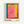May include: Framed abstract art print with vibrant rectangular color blocks in pink, yellow, orange and teal, displayed on white wall. Light wood frame surrounds white matted print featuring soft-edged geometric shapes that blend and overlap. Text below artwork reads "ROTHKO" and "1903-1970 A RETROSPECTIVE" in black letters. Painterly texture visible with subtle brushstrokes and color transitions creating dreamy, atmospheric effect.