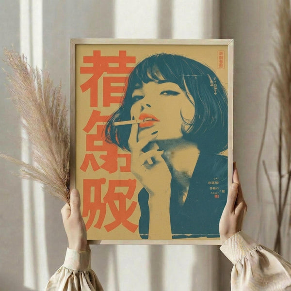 May include: Person holding framed vintage-style poster featuring woman with dark bob haircut smoking, rendered in teal and orange colors with Japanese text on cream background. Dried wheat stems visible in left hand. Soft natural lighting against neutral curtained backdrop.