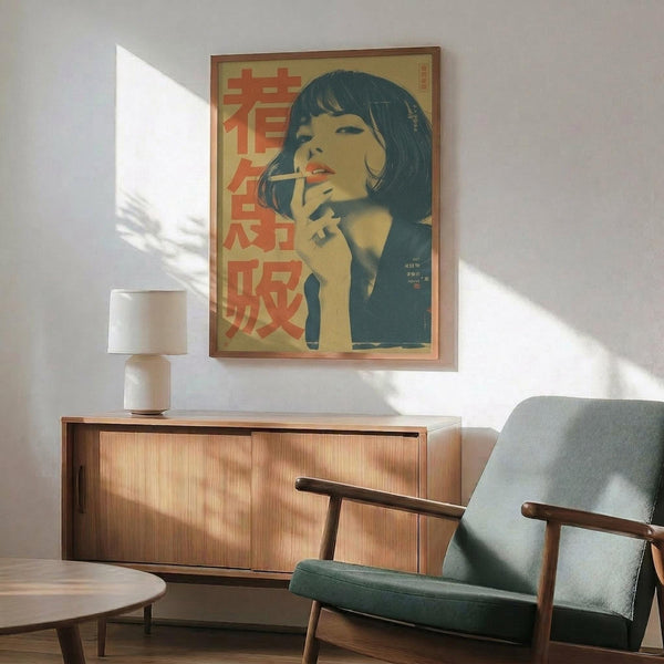 May include: Framed vintage-style poster featuring a woman with dark bob haircut and bangs, hand posed thoughtfully near her face, rendered in muted blue and beige tones with red Japanese characters. Displayed above a wooden mid-century modern credenza with white ceramic lamp, next to a gray upholstered armchair with wooden arms, warm sunlight casting shadows across white walls.