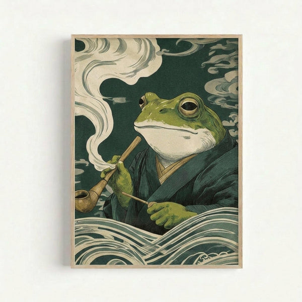 A framed poster artwork showing a green frog character in traditional Japanese robes smoking a wooden pipe, surrounded by swirling white smoke clouds and stylized waves. The illustration uses a muted color palette of greens, creams, and whites in classic ukiyo-e woodblock print style. The frog has large golden eyes and sits contemplatively amid the flowing, curved lines typical of Japanese wave motifs. The artwork is displayed in a light wooden frame against a white wall.