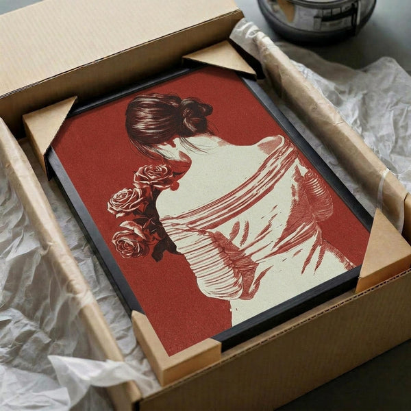 May include: Red and cream art print featuring elegant woman in profile with hair in bun, holding roses, displayed in black frame inside cardboard shipping box with protective tissue paper and wooden dowels for packaging