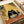 May include: Illustrated poster print displayed on white surface next to beige couch showing black fluffy cat with wide white eyes eating ramen noodles with chopsticks from gray bowl, orange-red floor, bamboo mat background, sake bottle and small yellow cup nearby, text reading "RELYSTES FULL ENERGY" at bottom in minimalist Japanese-inspired art style
