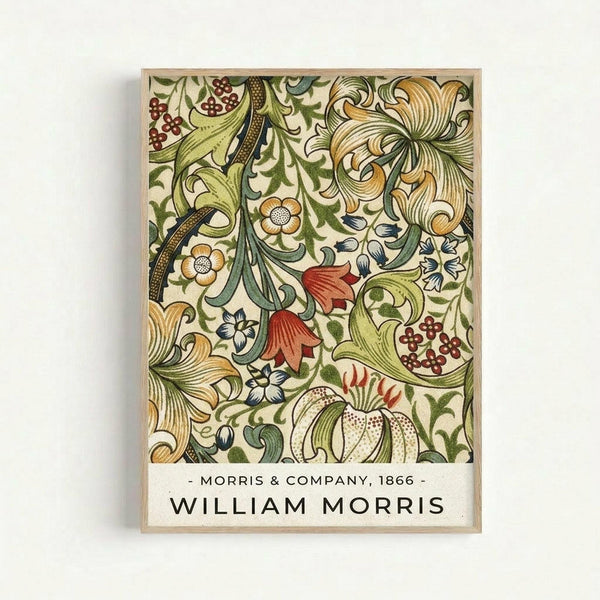 Framed botanical art print featuring intricate floral patterns in green, gold, red and cream colors. The design shows flowing vines, stylized flowers, berries and leaves in William Morris's distinctive Arts and Crafts style. White text at bottom reads "Morris & Company, 1866" and "William Morris" in black letters. The print is displayed in a thin natural wood frame against a light gray wall background.