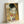 May include: Framed reproduction of Klimt's famous painting showing an embracing couple against ornate golden background with decorative patterns, circles, and geometric designs. The woman has closed eyes and dark hair, wearing a colorful floral dress. The artwork features rich golds, blues, greens, and jewel tones in Klimt's distinctive Art Nouveau style. Light wooden frame positioned against white wall.