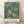 May include: Framed art print featuring an intricate Victorian floral pattern with golden chrysanthemums, ornate leaves, and decorative flowers on a deep teal background. The vintage-style botanical design fills most of the frame, with "Morris & Company, 1866" and "William Morris" text at the bottom on a cream banner. The wooden frame leans against white fabric draped behind it, sitting on light wood flooring with natural shadows cast across the scene.