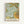 Framed botanical art print featuring William Morris's 1866 design with ornate acanthus leaves in sage green and white, golden yellow flowers, and flowing curved stems against a pale blue background. The decorative pattern shows intricate Victorian-style florals with detailed texturing and organic flowing forms. Text at bottom reads "Morris & Company, 1866" and "William Morris" in black lettering on cream background. Natural wood frame visible around edges, displayed against white wal