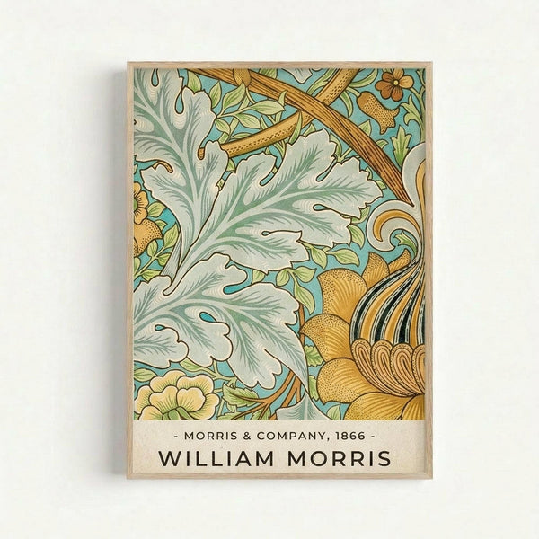 Framed botanical art print featuring William Morris's 1866 design with ornate acanthus leaves in sage green and white, golden yellow flowers, and flowing curved stems against a pale blue background. The decorative pattern shows intricate Victorian-style florals with detailed texturing and organic flowing forms. Text at bottom reads "Morris & Company, 1866" and "William Morris" in black lettering on cream background. Natural wood frame visible around edges, displayed against white wal