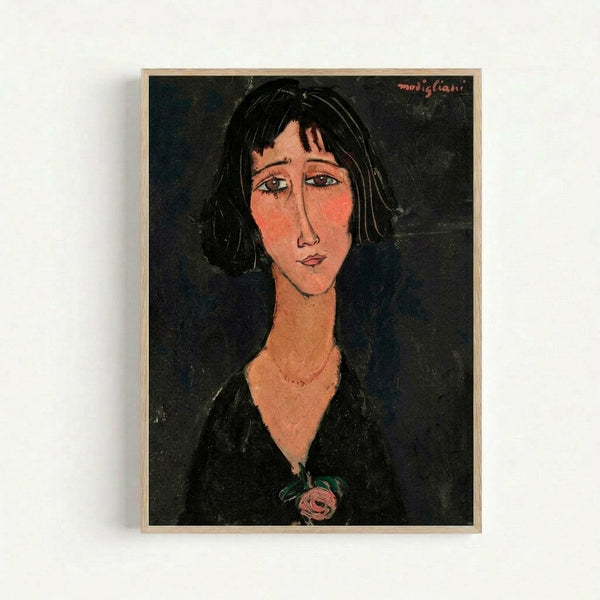 Portrait painting of a woman with short black hair and elongated facial features in an expressionist style. She wears a black dress or jacket with a small pink rose detail at the chest. The background is dark, and her face has warm peachy tones with distinctive almond-shaped eyes. The artwork is displayed in a thin wooden frame against a white wall.