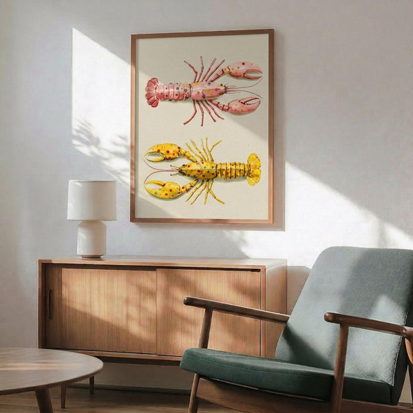 May include: Framed marine illustration print featuring two lobsters with polka dot patterns - pink spotted lobster on top and yellow spotted lobster below - displayed on white wall above wooden sideboard with white ceramic lamp, next to mint green upholstered armchair with wooden frame in sunlit modern interior