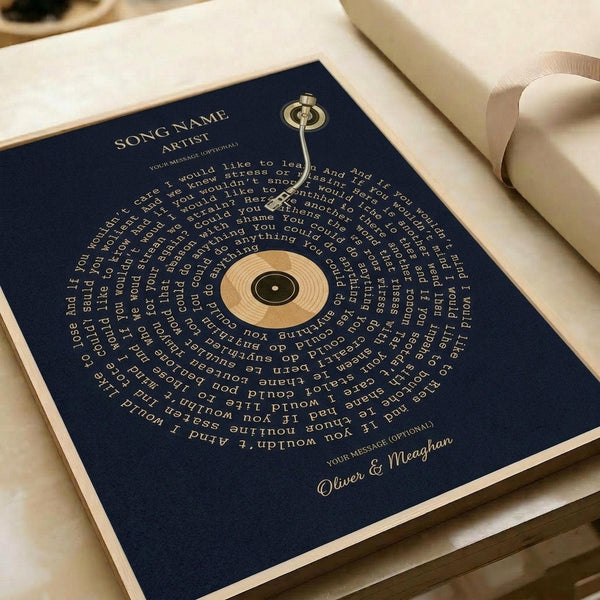 May include: Navy blue square poster with gold text arranged in a spiral pattern around a central vinyl record design. Song lyrics curve in concentric circles with "SONG NAME" and "ARTIST" at top, and "Oliver & Meaghan" signature at bottom. Displayed in white gift box with cream ribbon, showing elegant typography on dark background.