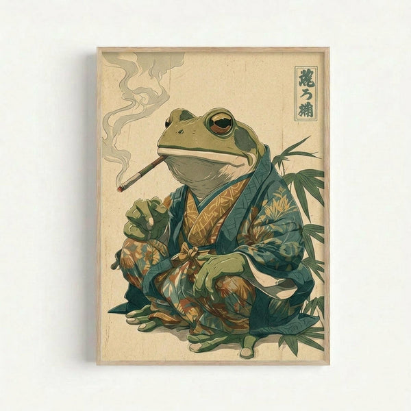 Vintage-style Japanese woodblock print artwork featuring a large green frog wearing an ornate teal and gold patterned kimono, smoking a long pipe with wisps of smoke curling upward. The frog sits among bamboo leaves against a cream background with Japanese characters in the upper right corner. The illustration has muted earth tones and traditional ukiyo-e art styling, displayed in a light wooden frame.