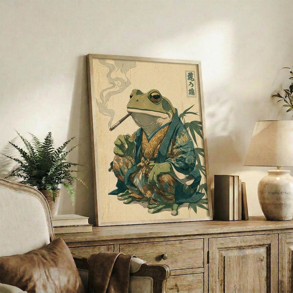 May include: Framed Japanese-style artwork of a green frog wearing traditional kimono and smoking a pipe, displayed on rustic wooden console with books, ceramic vase, and fern plant in neutral-toned living room setting with beige armchair visible