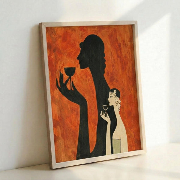 May include: Framed poster with orange textured background featuring black silhouette of elegantly dressed figure holding wine glass, alongside smaller light-colored woman with curly hair also holding glass. Art deco style artwork in light wooden frame, leaning against white wall corner showing perspective and shadow.