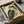 May include: Framed vintage Japanese woodblock print of an owl with detailed brown and green feathers and bright yellow eyes, surrounded by Japanese text. The black-framed artwork sits in an open cardboard box with tissue paper padding, alongside rolled paper tubes on a white surface.