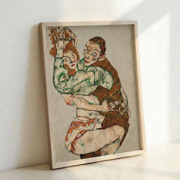 May include: Framed reproduction of an early 20th century expressionist drawing showing two embracing figures rendered in loose, gestural lines with muted green, brown, and red tones. The artwork is displayed in a simple light wood frame leaning against a white wall, showcasing the intimate, angular style characteristic of Austrian expressionist art.