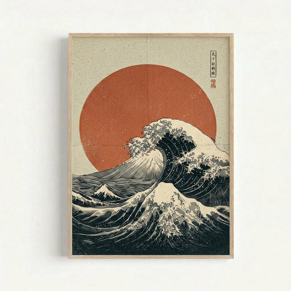 Framed Japanese-style woodblock print featuring a large crashing wave with white foam against a beige background and prominent red-orange sun. The artwork displays traditional ukiyo-e styling with dark blue-green water, dramatic curved wave forms, and Japanese text characters in the upper right corner. The print is mounted in a light wood frame and photographed against a white wall, showing the textured paper surface and vintage aesthetic.