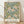 May include: Framed botanical poster print featuring vintage floral pattern with pink chrysanthemums, green foliage, and navy blue accents on cream background. Light wood frame leans against white textured wall above wooden floor with natural sunlight casting shadows across the scene.