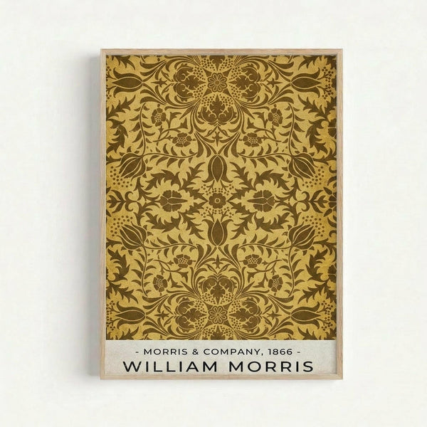 Ornate Victorian-style decorative pattern in golden yellow and brown tones featuring symmetrical floral and foliate motifs with intricate scrollwork and botanical elements. The design shows repeating damask-style ornamental details in a traditional Arts and Crafts movement aesthetic. Displayed as a framed print with light wood frame against white wall, with attribution text at bottom reading Morris & Company, 1866 and William Morris.