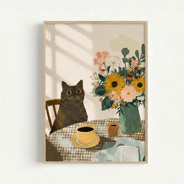 Framed art print showing a dark gray cat with yellow eyes sitting at a checkered tablecloth-covered table. A yellow coffee cup and saucer, wooden mug, and open book are on the table. A green ceramic vase holds sunflowers, pink flowers, and greenery. Natural sunlight casts diagonal shadows across the cream-colored background. The illustration has a cozy, vintage folk art style with warm earth tones.
