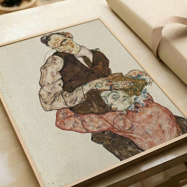 Expressionist drawing of two figures in an intimate embrace, rendered in earthy tones of brown, red, and muted colors with bold black outlines. The artwork is displayed as a print on cream paper with visible texture and speckled surface, lying flat in an open book or portfolio with white pages and ribbon bookmark visible at the edge.