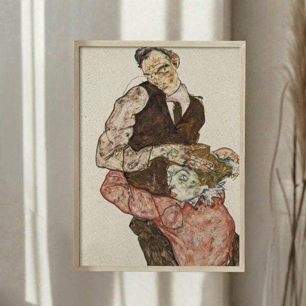May include: Framed expressionist artwork showing two figures in earth tones - a man in dark vest and white shirt above, and a person in coral-red clothing with decorative hat below. The sketchy, linear style features muted colors against cream background. Simple light wood frame hangs on white wall with soft natural lighting and curtains visible.