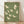 May include: Framed poster with olive green background featuring nine cream-colored cranes in flight, displayed in light wooden frame leaning against white wall on light wood floor with soft natural lighting and fabric shadows