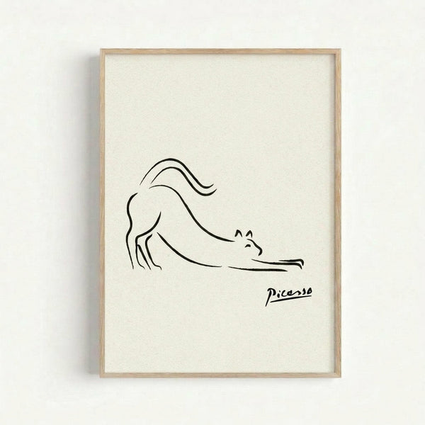 May include: Minimalist line drawing of a stretching cat in black ink on cream paper, displayed in a light wood frame against a white wall. The simple, continuous line artwork shows a cat in a downward stretching pose with an arched back and extended tail, signed "Picasso" in the bottom right corner.
