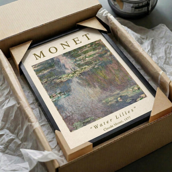 May include: Framed art print of Monet's Water Lilies painting showing impressionist pond scene with soft greens, purples, and blues, displayed in dark frame on cream mat. Wooden frame pieces and white tissue paper visible in brown cardboard box packaging on neutral surface.