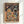 May include: A framed poster print hanging on a white wall showing two cartoon cats in space suits sitting at a table on a planet surface. The orange tabby cat holds freeze-dried tuna while the black cat holds galaxy bubbles. Various colorful space foods, fruits, and space milk are scattered on the table. A rocket ship, Earth, and starry galaxy backdrop complete the whimsical astronaut scene in a light wood frame.