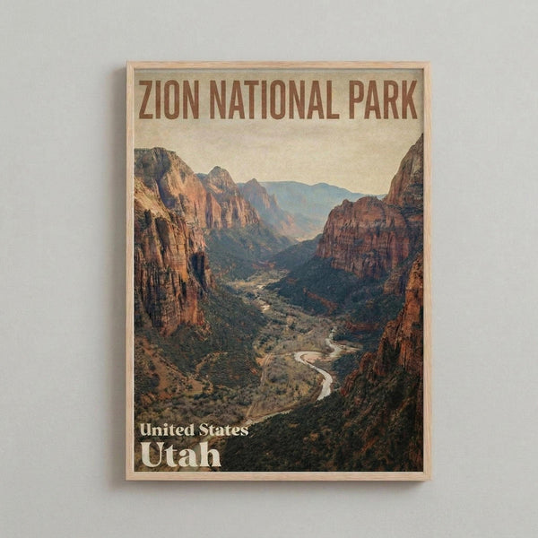 May include: Framed vintage-style travel poster hanging on white wall, featuring Zion National Park canyon landscape with towering red rock cliffs, winding river through green valley floor, and layered mountain ranges under pale sky. Natural wood frame with warm honey finish.