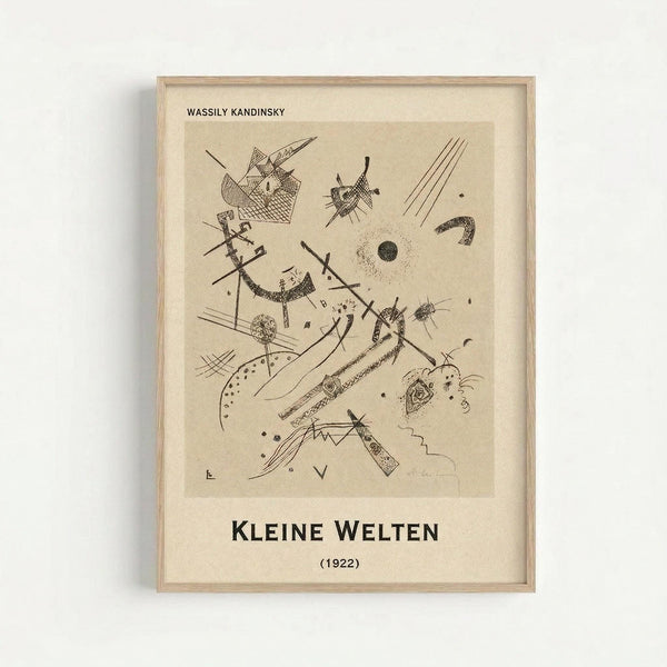 Framed abstract artwork print featuring geometric shapes, lines, and organic forms in black ink on cream paper. The composition includes angular patterns, curved elements, circles, and crosshatched textures scattered across the surface. Text at top reads "WASSILY KANDINSKY" and bottom shows "KLEINE WELTEN (1922)" in bold black letters. Light wood frame with white matting displayed against neutral background.