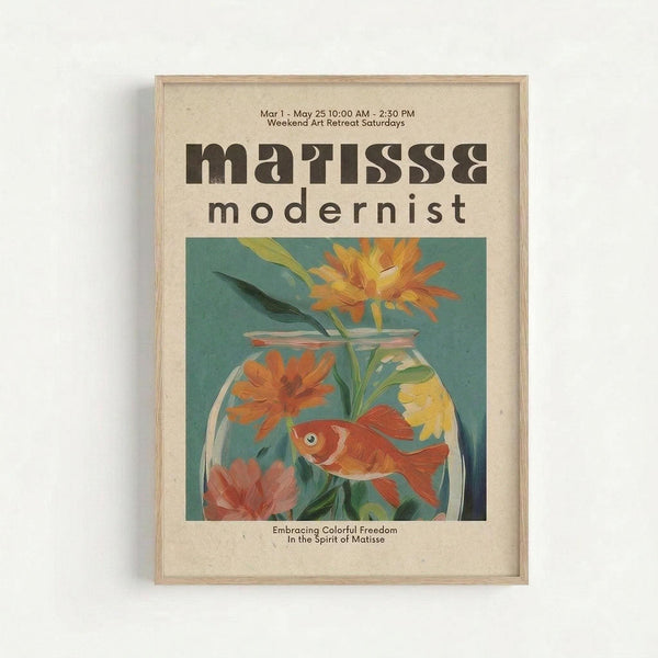 A framed vintage-style art poster featuring a colorful illustration of an orange goldfish swimming in a glass fishbowl with vibrant flowers including orange and yellow blooms with green stems against a teal background. The cream-colored poster displays "matisse modernist" in brown retro typography at the top, with exhibition details and "Embracing Colorful Freedom In the Spirit of Matisse" text below the artwork. The print is mounted in a light wood frame and hung on a white wall.