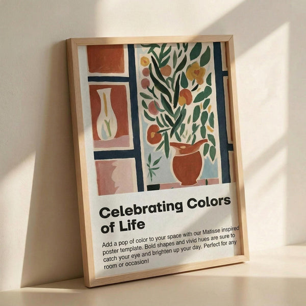 May include: Framed poster with Matisse-inspired artwork showing colorful still life scene with vases, plants, and geometric shapes in terracotta, green, and blue tones. Light wood frame rests against white wall with natural shadows. Text below artwork reads "Celebrating Colors of Life" with descriptive paragraph about adding color to spaces.