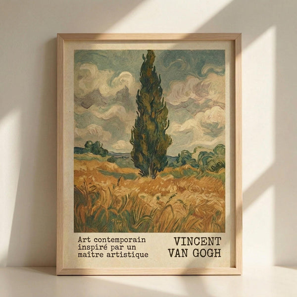 May include: Framed poster print featuring Van Gogh-style landscape with tall dark cypress tree in center, golden wheat field in foreground, swirling cloudy sky in blues and whites. French text below reads "Art contemporain inspiré par un maître artistique" and "VINCENT VAN GOGH" in black typography. Light wood frame against white wall with natural sunlight shadows.