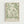 May include: Framed botanical art print with flowing sage green leaf patterns on cream background, displayed in light wood frame against white wall. Features elegant swirling foliage motifs in William Morris style with exhibition text at bottom.