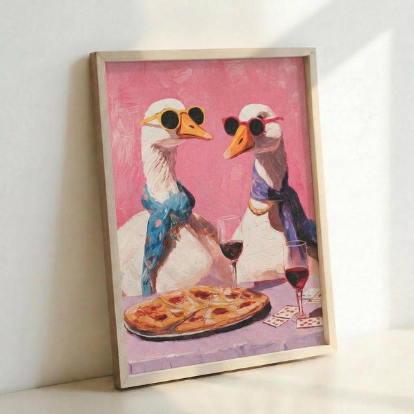 May include: Framed poster print leaning against white wall showing two white geese wearing sunglasses and scarves sharing pizza and red wine on pink and purple background. Light wood frame, painterly illustration style with visible brushstrokes, whimsical romantic dinner scene.