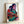 Vintage-style pop art poster showing a tender portrait of a Native American mother and child rendered in Warhol's signature bright, layered color palette.