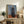 Expressionist artwork depicting a solitary figure in black and violet, framed as a gallery-quality poster with an introspective, haunting atmosphere.