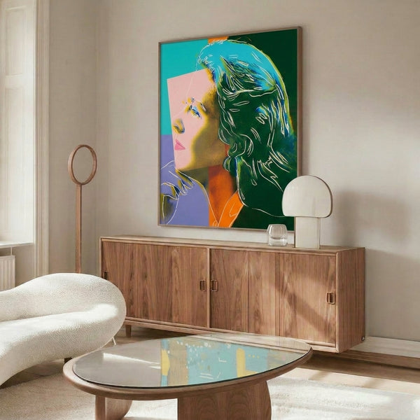 Framed pop art artwork featuring Ingrid Bergman rendered in vibrant, luminous colors with graphic intensity and Warhol's distinctive approach to celebrity imagery.