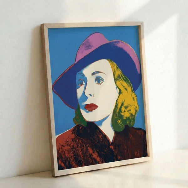 Modern pop art poster of actress Ingrid Bergman with hat, displaying the iconic silkscreen aesthetic with bright, electric hues.