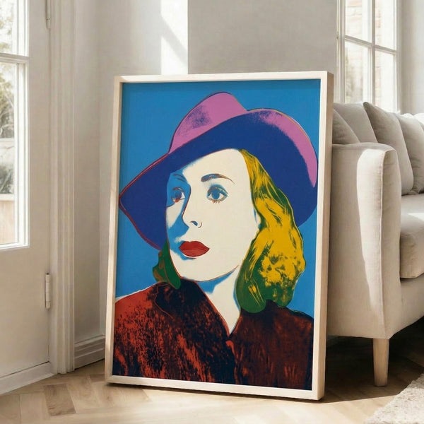 Andy Warhol-inspired portrait art print of Ingrid Bergman wearing a hat, with characteristic pop art color separation and graphic style.