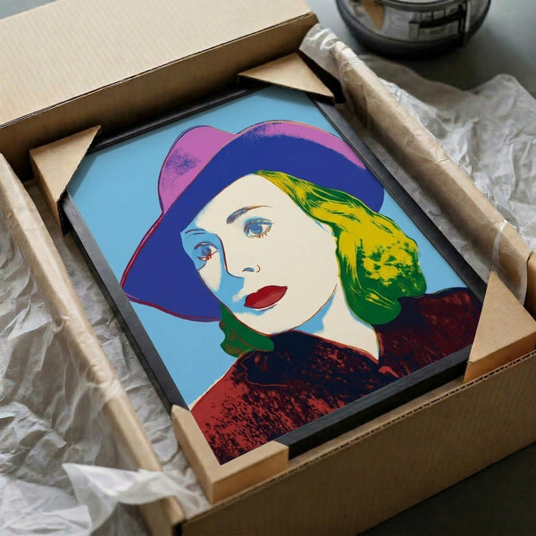 Colorful pop art portrait print of Ingrid Bergman wearing a hat, showcasing the distinctive Warhol approach to celebrity imagery and chromatic contrast.