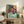Framed artwork depicting a girl reading in an elegantly composed domestic interior, rendered in saturated colors and simplified shapes that emphasize calm focus and literary engagement.