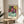 Matisse-style poster art of a young girl reading in a richly colored interior space with vibrant blue, red, and yellow tones expressing intimate domestic tranquility.