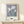 Japandi wall art displaying a single iris bloom with graceful stem in subdued lavender and green palette, calm and botanical in mood.